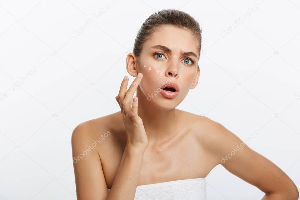 beauty girl of caucasian woman checks her skin, skin care, acne treatment.