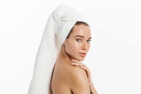 Spa skin care beauty woman wearing hair towel after beauty treatment. Beautiful young woman with perfect skin isolated on white background. — Stock Photo, Image