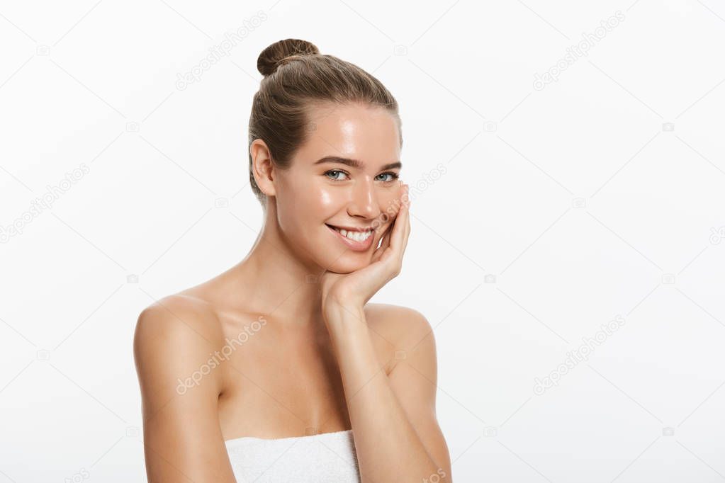 Beautiful smiling woman with clean skin isolated on white background