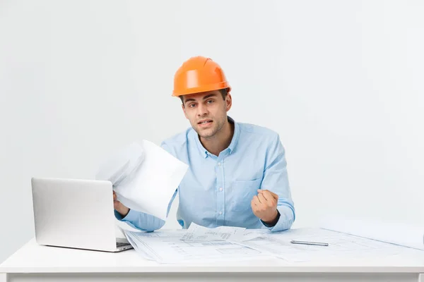 Focused serious hardworking engineer busy working on big architectural project late, sitting at his workspace using digital tablet pc. People, job, occupation and profession concept — Stock Photo, Image