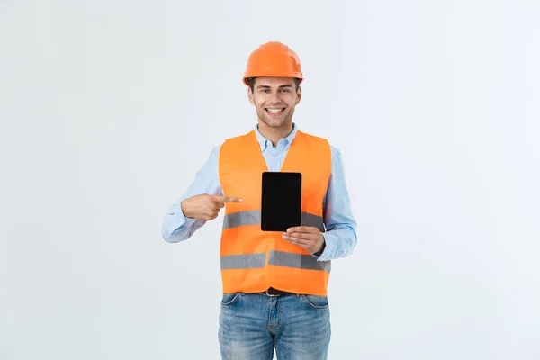 Happy young construction workers in hard hats on a white background. — Stock Photo, Image