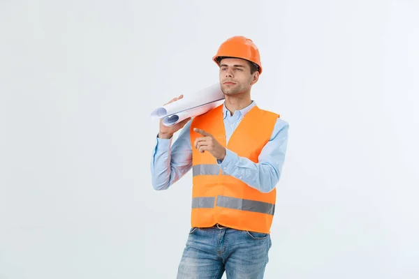 Supply of building materials concept. Engineer, architect on busy face ,holds blueprints, pointing with finger, copy space. — Stock Photo, Image