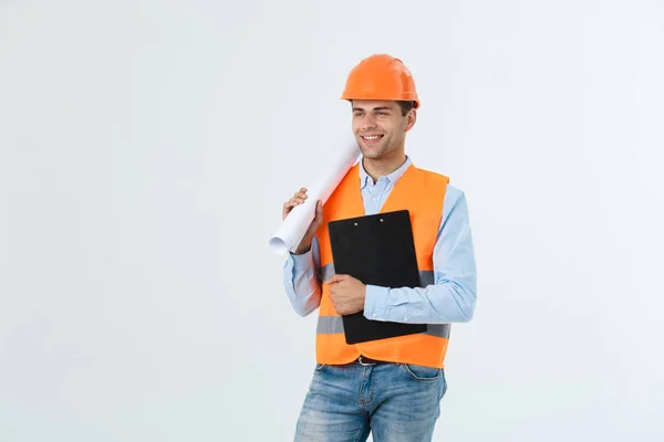 Halve lengte portret van jonge glimlachend knappe architect ingenieur in oranje helm poseren met blauwdrukken kijken camera geïsoleerd op een witte achtergrond, copyspace — Stockfoto