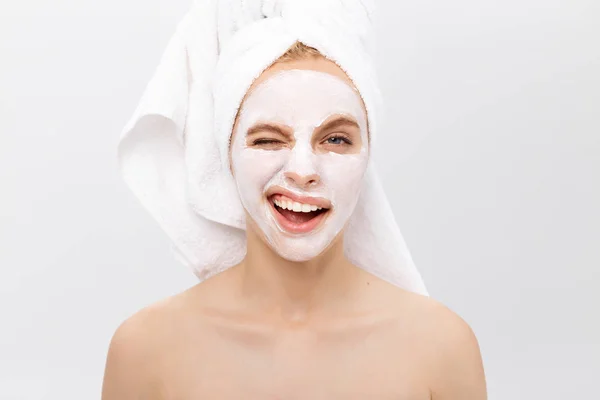 Beautiful woman with facial mask on white background — Stock Photo, Image