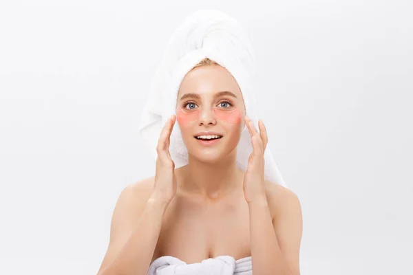 Close up of a young woman with patches under eyes from wrinkles and dark circles. Isolated on white background — Stock Photo, Image