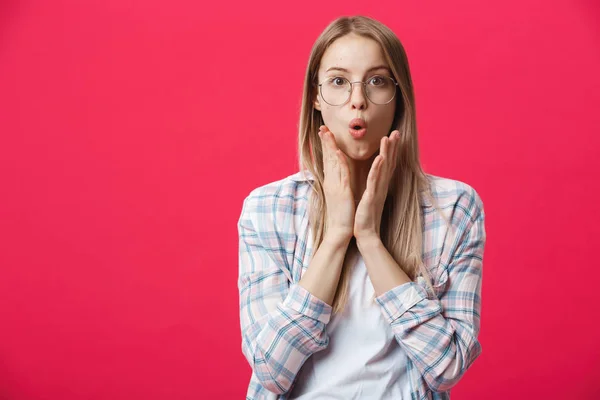 Surprised teenage student girl show shocking expression with something. Isolated on Bright Pink Background. Copy space — Stock Photo, Image