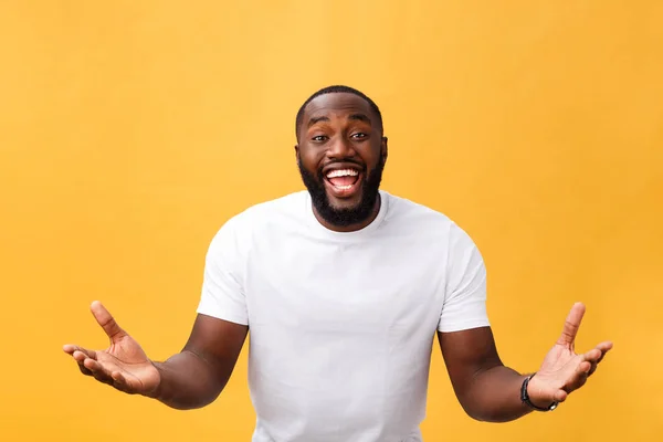 stock image Amazed young African American hipster wearing white t-shirt holding hands in surprised gesture, keeping mouth wide open, looking shocked