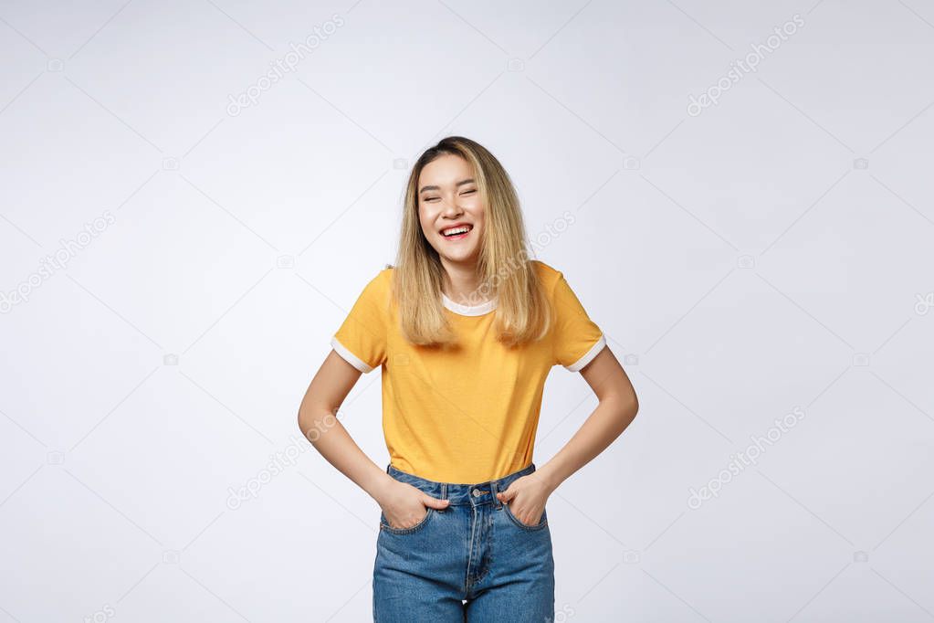 Young friendly Asian woman with smiley face isolated on white background.