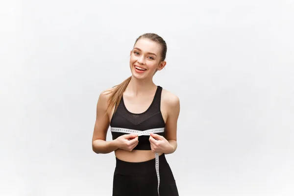 Portrait of attractive caucasian smiling woman with measuring tape isolated on white background. — Stock Photo, Image