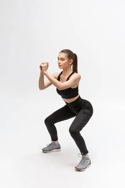 Exercício. Mulher de esportes na moda Sportswear estiramento Pernas — Fotografia de Stock