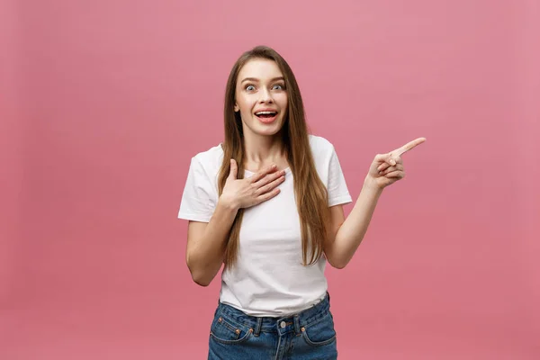 Woman pointing finger at camera and toothy smiling. Expression emotion and feelings concept. Studio shot, isolated on pink background — Stock Photo, Image