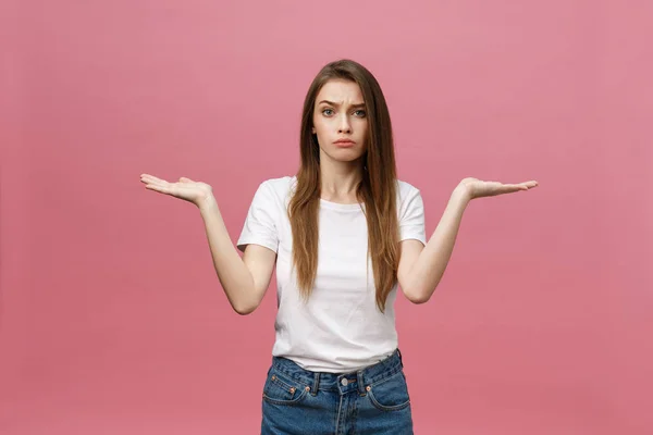 Young beautiful woman Pointing hand to the side showing advertisement, serious and calm face — Stock Photo, Image