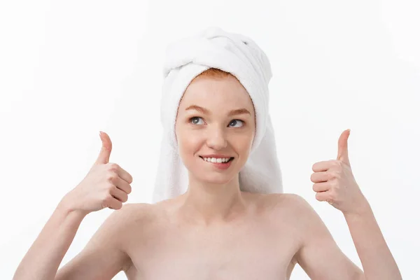 Portrait of young beautiful woman on white backgeound shows thumbs up. — Stok Foto