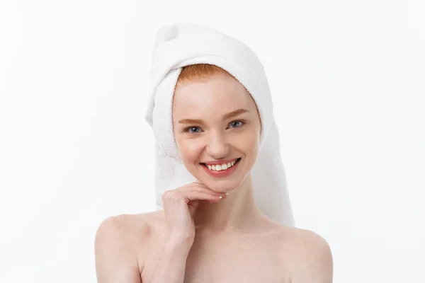 Surprised Beautiful Young Woman After Bath with A Towel On Her Head Isolated On white Background. Skin Care And Spa Theme. — Stock Photo, Image