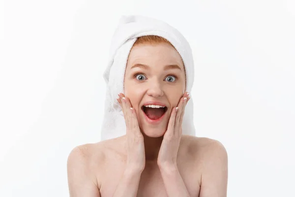 Surprised Beautiful Young Woman After Bath with A Towel On Her Head Isolated On white Background. Skin Care And Spa Theme. — Stock Photo, Image