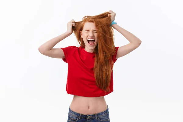 Picture of angry young woman standing isolated over white background. Looking camera — Stock Photo, Image