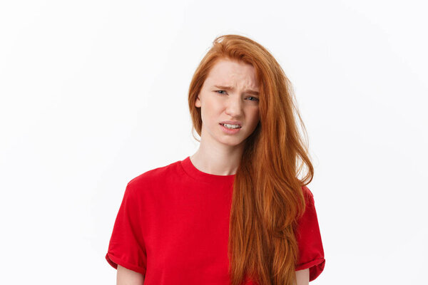 Young stressed european blonde woman looking at camera isolated on white background.