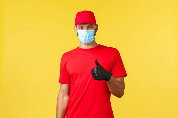 Express delivery during pandemic, covid-19, safe shipping, online shopping concept. Courier provide excellent and fast mail delivery or shipping, show thumb-up, encourage call their service company — Stock Photo, Image