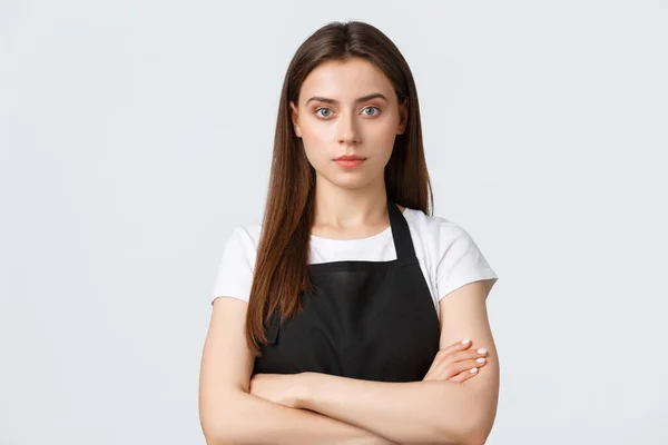 Employees, job employment, small business and coffee shop concept. Close-up of serious-looking confident cafe staff, restaurant personal in black apron cross arms chest determined — Stock Photo, Image