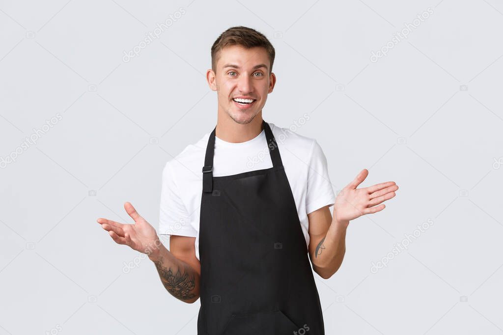 Small business owners, coffee shop and staff concept. Friendly-looking handsome barista inviting visit restaurant, we are open, smiling joyful as taking order from guest, white background