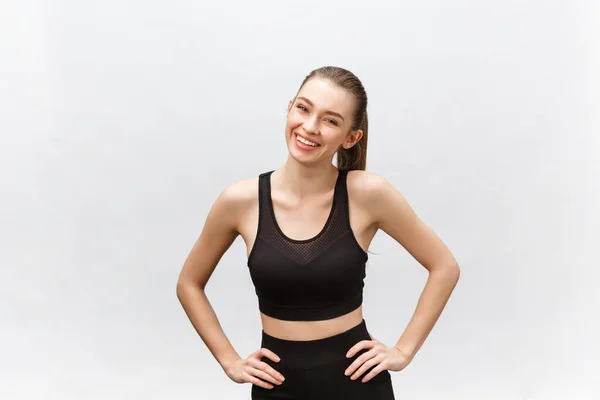 Image of a beautiful strong happy cheerful young sports woman posing isolated on grey background. — Stock Photo, Image