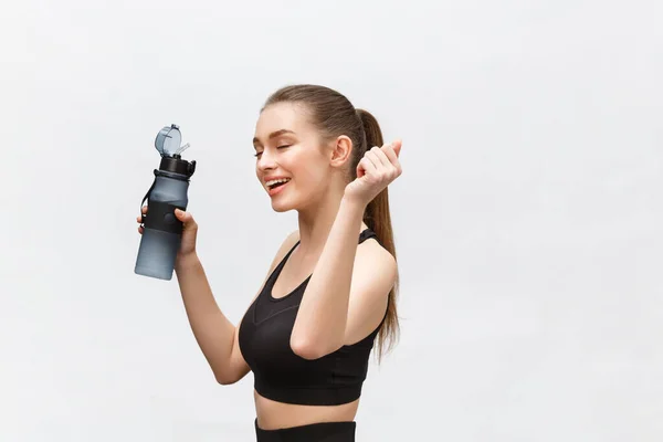 Sport, fitness, lifestyle and people concept - happy sportive woman with water bottles. — Stock Photo, Image