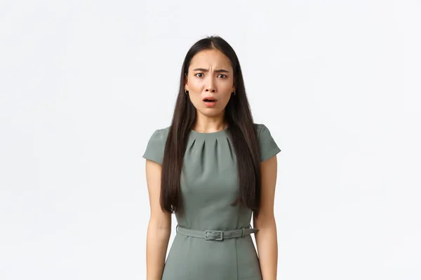 Small business owners, women entrepreneurs concept. Disappointed and frustrated asian businesswoman looking distressed, being upset with something, standing white background — Stock Photo, Image