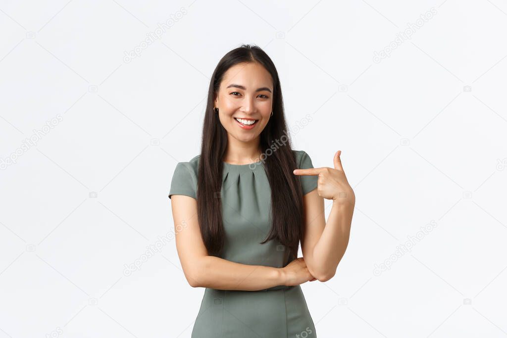 Small business owners, women entrepreneurs concept. Confident successful asian businesswoman pointing at herself and smiling assertive, promoting herself, personal help, white background