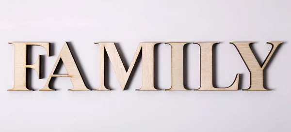 Word FAMILY is made from wooden letters isolated on a white background — Stock Photo, Image