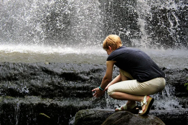 woman on the waterfall