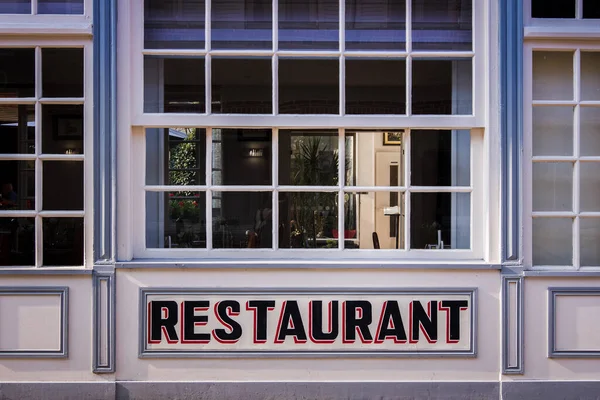 Restaurant facade in France . Restaurant text uppercase