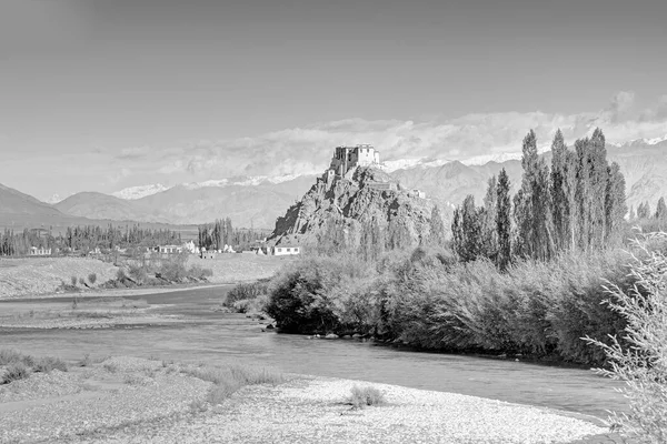 Stakna monastery with view of Himalayan mountians - it is a famous Buddhist temple in,Leh, Ladakh, Jammu and Kashmir, India. Black and white image.