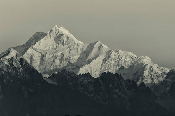 Beautiful first light from sunrise on Mount Kanchenjugha, Himalayan mountain range, Sikkim, India. Tinted stock image.