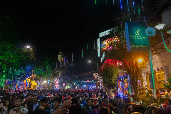 KOLKATA, WEST BENGAL, INDIA - DECEMBER 25TH 2017 : Beautiful decorated lighting of Merry Christmas at night at Park Street, Kolkata. People celebrating Merry Christmas.