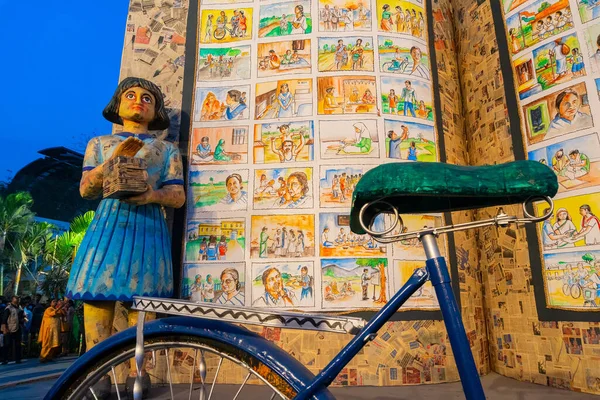 KOLKATA, INDIA - FEBRUARY 11TH , 2018 : Sculpture of a Girl child, her cycle and her books on display for promotion of books at Kolkata book fair. It is world\'s largest and most attended book fair.