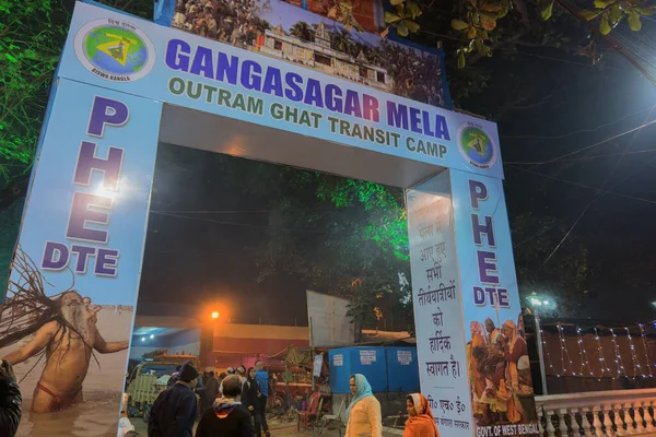 BABUGHAT, KOLKATA, WEST BENGAL / INDIA - 9TH JANUARY 2018 : Transit camp for Gangasagar for Makar Sankranti (Holy bathing at river Ganges). Shot agsint colored light and holy smoke.