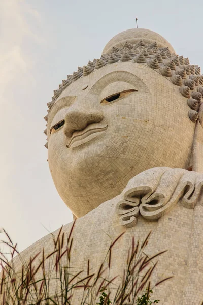 Amazing Massive white marble Buddha statue, the famous tourist attraction on top of hill in Phuket, Thailand.