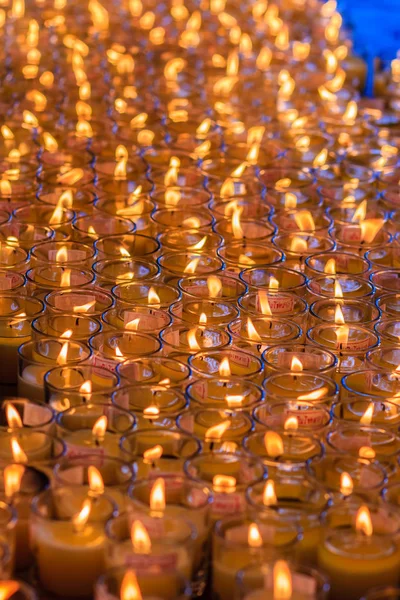 Orange candles in glasses from Chinese temple, Red candle is kindle a fire in glass at the Chinese temple, Prepare for Chinese new year. Shallow depth of field.