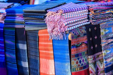 Beautiful Thai tribal clothes and tribal textile style in the northern of thailand. Beautiful handmade tribal cloth ethnic patterns for sale in the local market. clipart