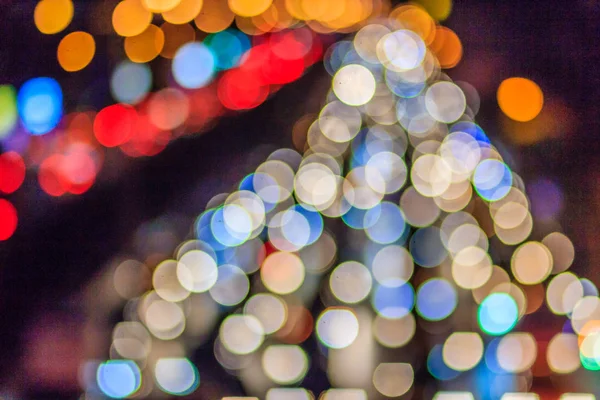 Abstract blur bokeh of Evening traffic jam on road in city. Out of focus lights from cars in a traffic jam. Defocused lights car traffic jam of a street road at night. Road traffic jam by blur focus.