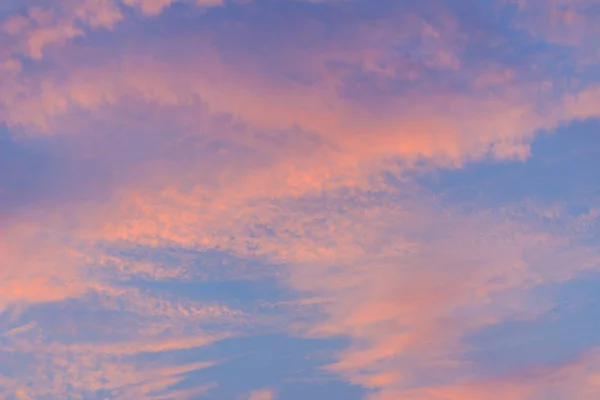 Colorful with red, orange and blue dramatic sky on the clouds for abstract background. Romantic sunset background with beautiful blue, red and yellow clouds.