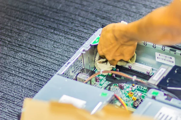 Close up hands of technician during repair desktop computer