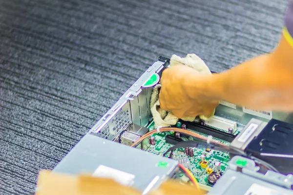 Close up hands of technician during repair desktop computer