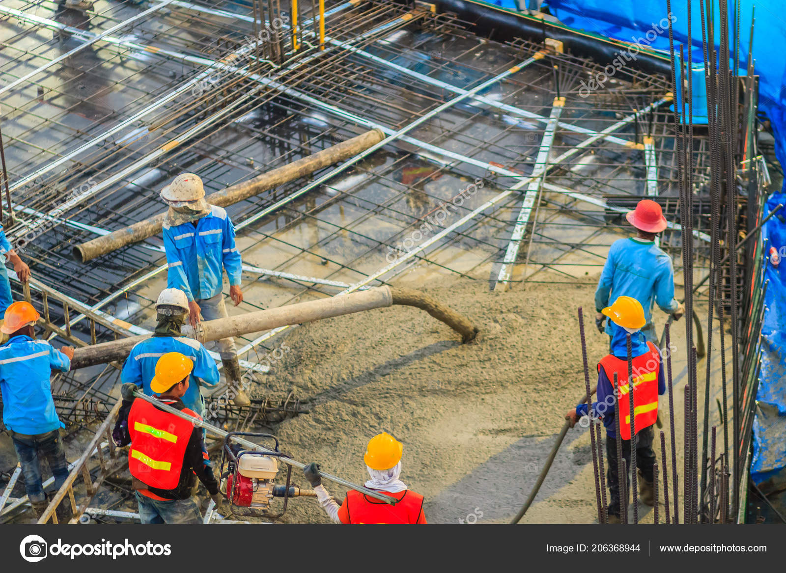Construction Workers Pouring Concrete Post Tension Flooring Work Mason