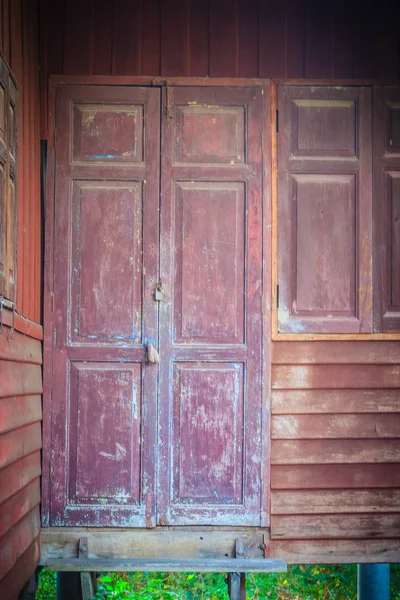 Old vintage wooden brown house door background.