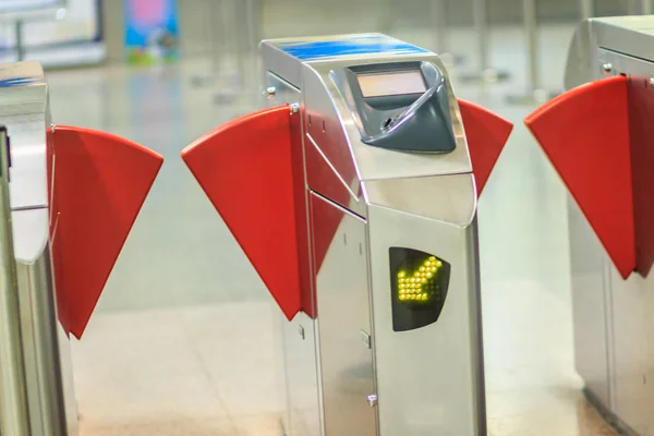 Automatic access control ticket barriers in subway station. View of barrier gate before access in to subway station. Automatic ticket barriers at subway entrance.