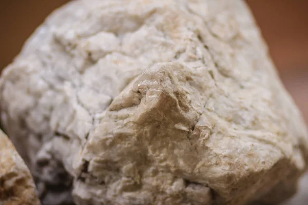 Raw specimen of Barite stone from mining and quarrying. Baryte or barite (BaSO4) is a mineral consisting of barium sulfate. Baryte is generally white or colorless, and is the main source of barium.