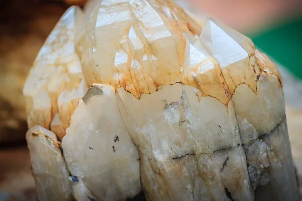 Raw specimen of quartz crystal stone from mining and quarrying industries. Quartz is a mineral composed of silicon and oxygen atoms that commonly used in the making of jewelry and hard stone carvings.