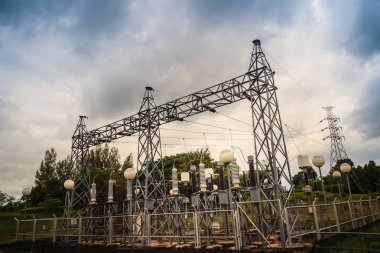 High voltage transformers and electric converters equipment in switchyard of hydroelectric power plant at Pak Mun Dam, a run-of-river hydroelectricity in Ubon Ratchathani Province, Thailand. clipart