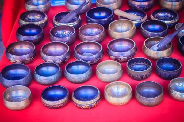 Tibetan singing bowls for sale at the antique market. Singing bowls also known as rin gongs, Himalayan bowls or suzu gongs are used worldwide for meditation, music, relaxation, and personal well-being